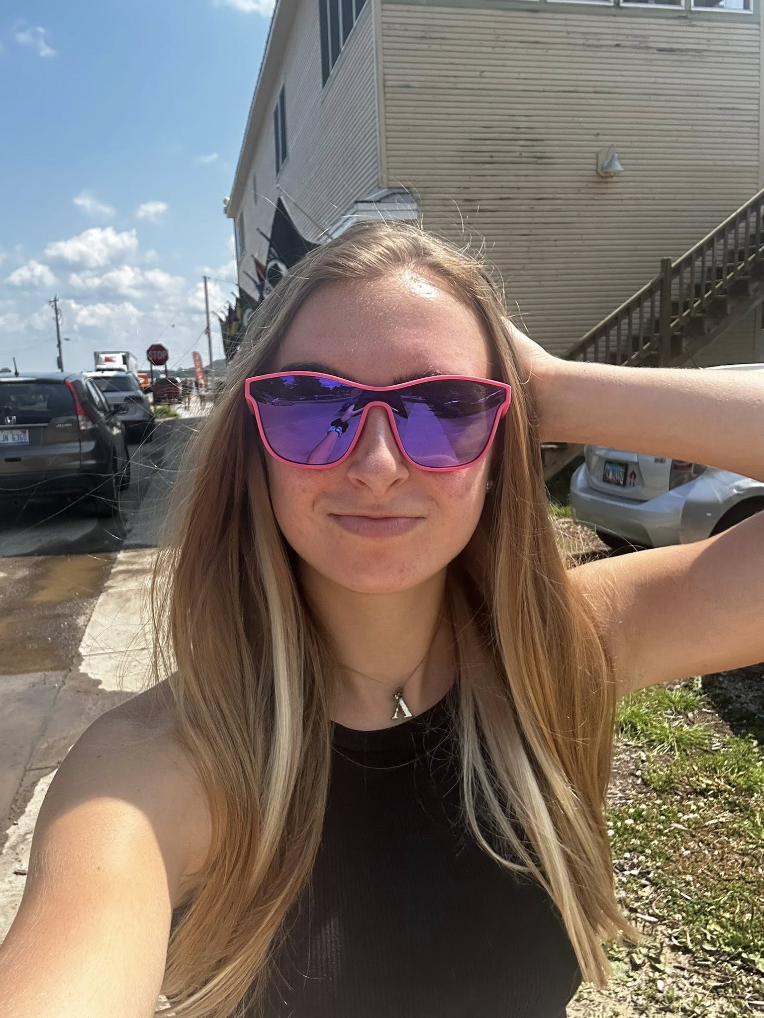 Abby Irvine, Austin photographer, smiling and holding a camera