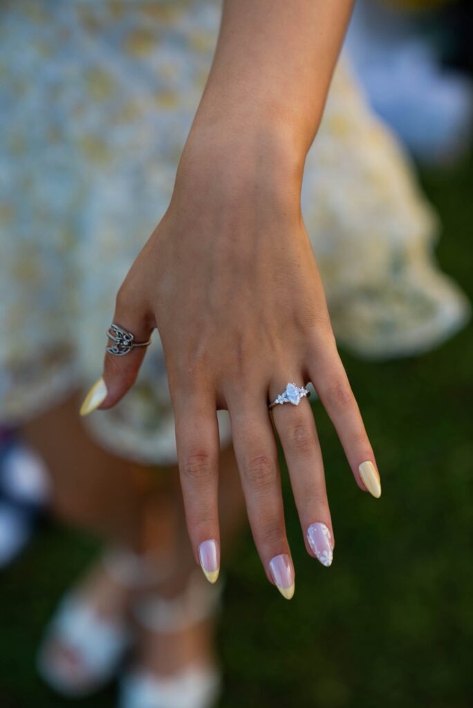 Close-up photo of engagement ring on hand in Austin — taken by Abigail Paige Productions